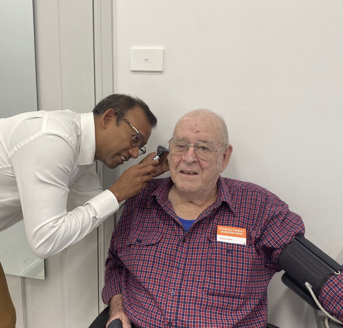 Doctor examining elderly patient
