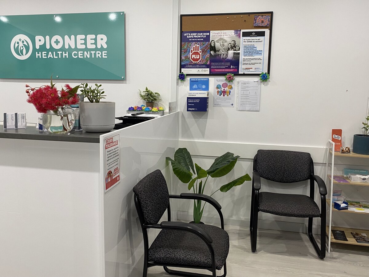 Reception area with Pioneer Health Centre sign